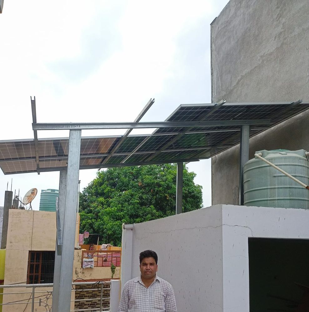 Completed rooftop solar panel installation with two panel rows on a residential building in Lucknow